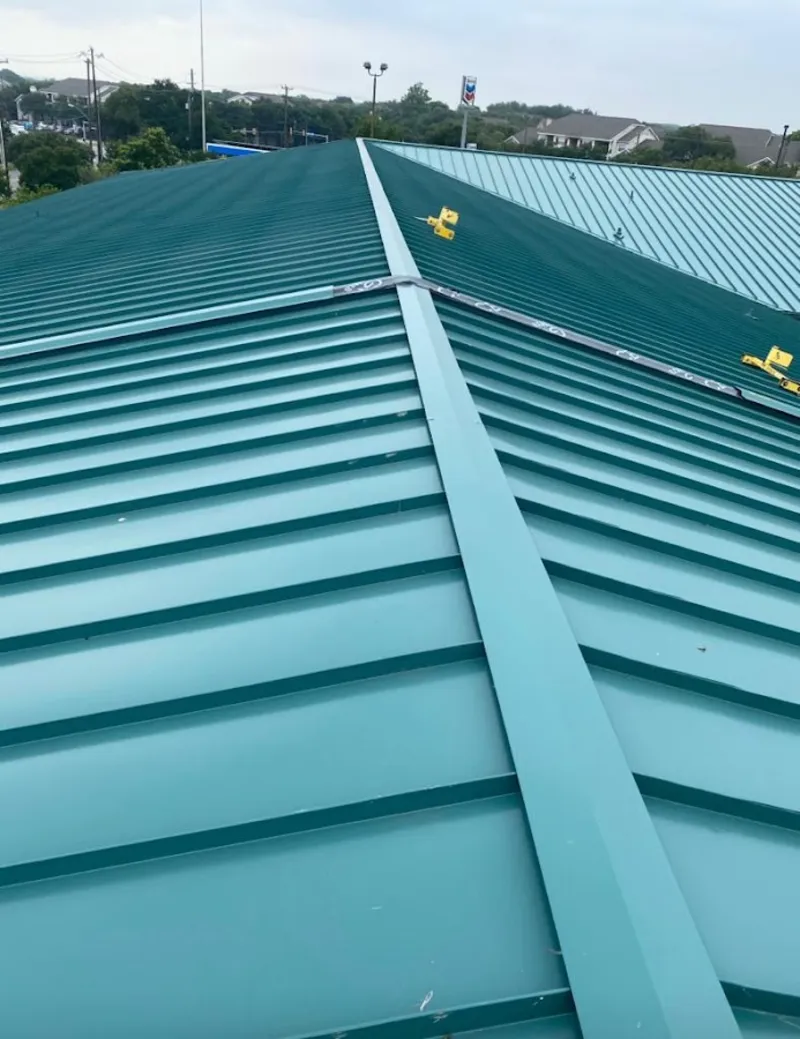 Green commercial metal roof ridge and valley for Metal Roof Repair in Batesville